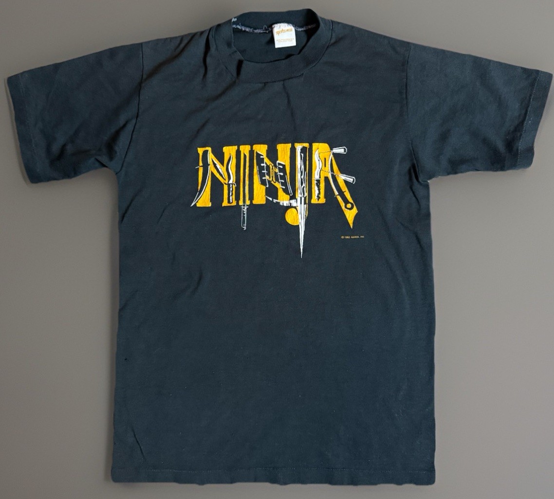 Vintage 80s AWMA, Inc NINJA Single-Stitched Black T-Shirt XSmall By Russell USA