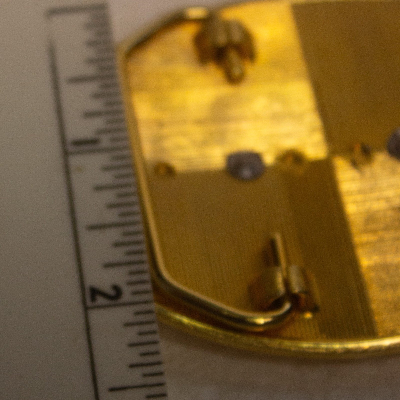 Vintage Masonic belt buckle featuring a gold‑tone oval base with a raised silver