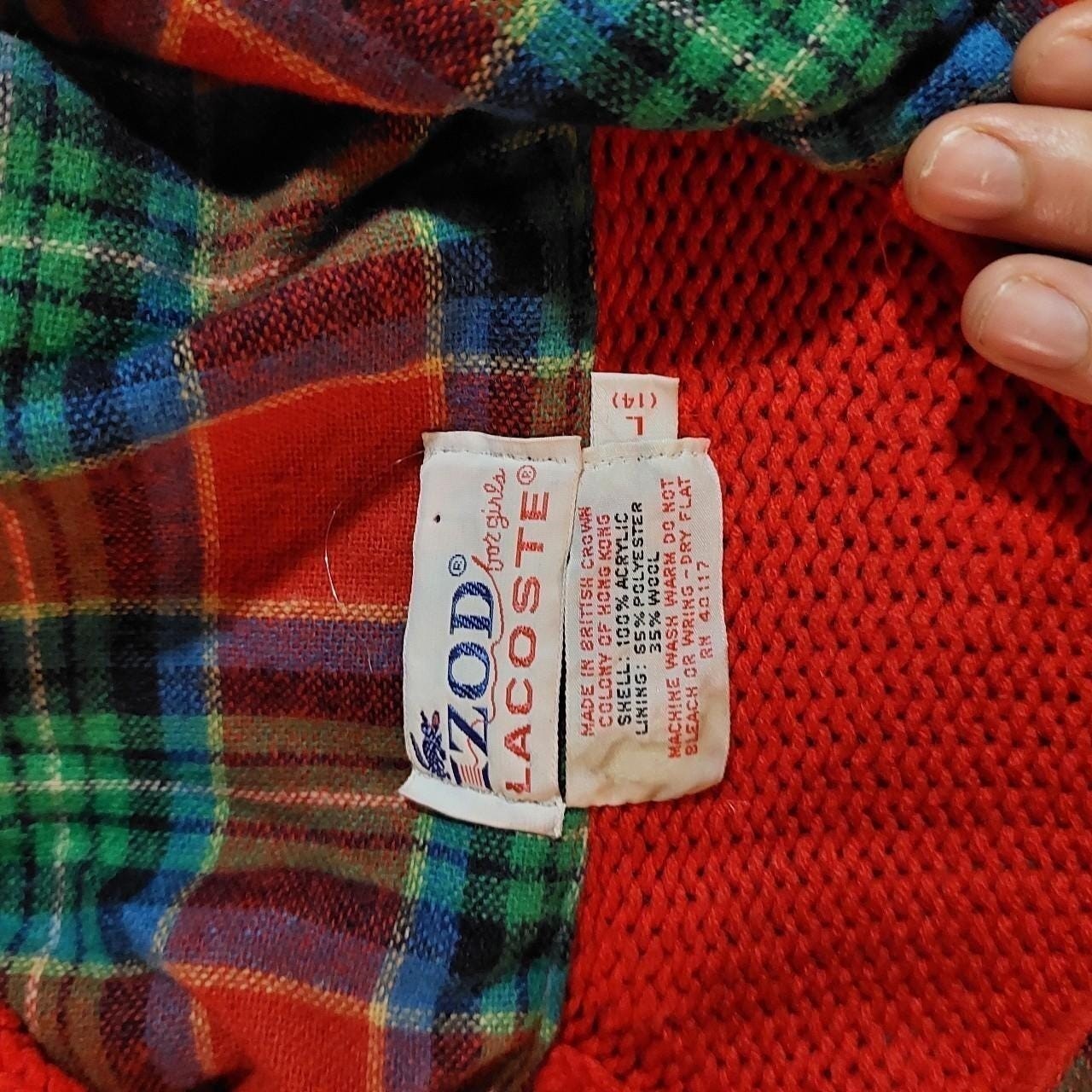 Vintage red Lacoste hooded sweater with plaid detail and pockets.