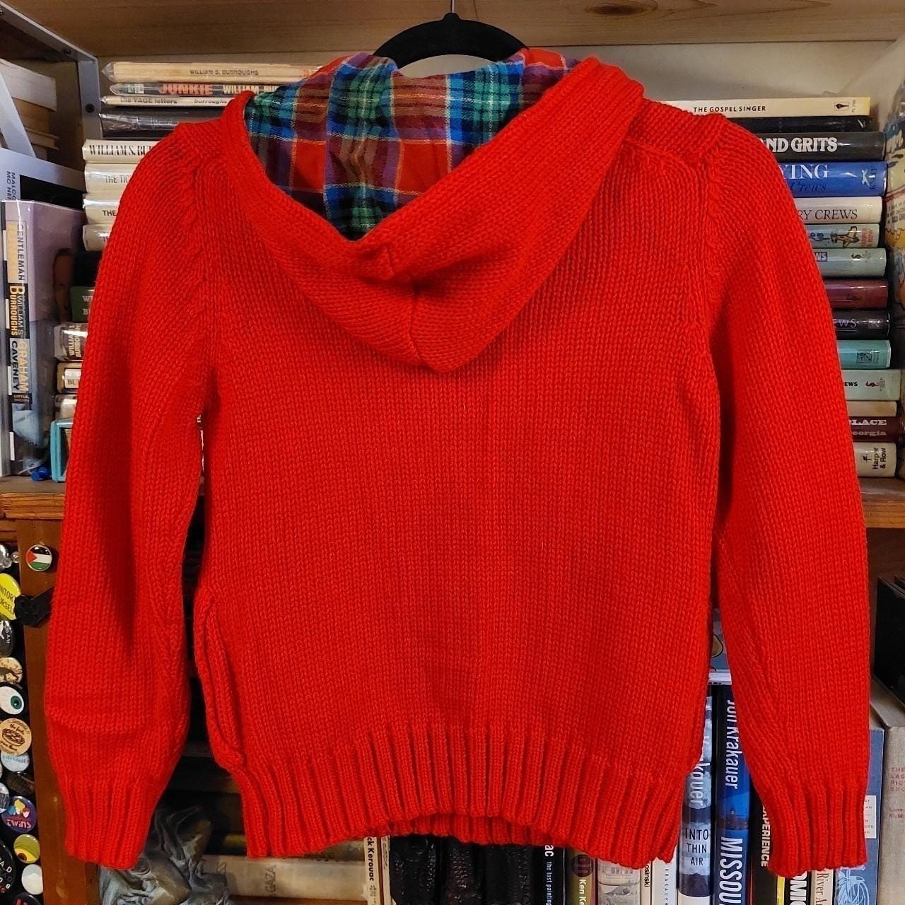 Vintage red Lacoste hooded sweater with plaid detail and pockets.
