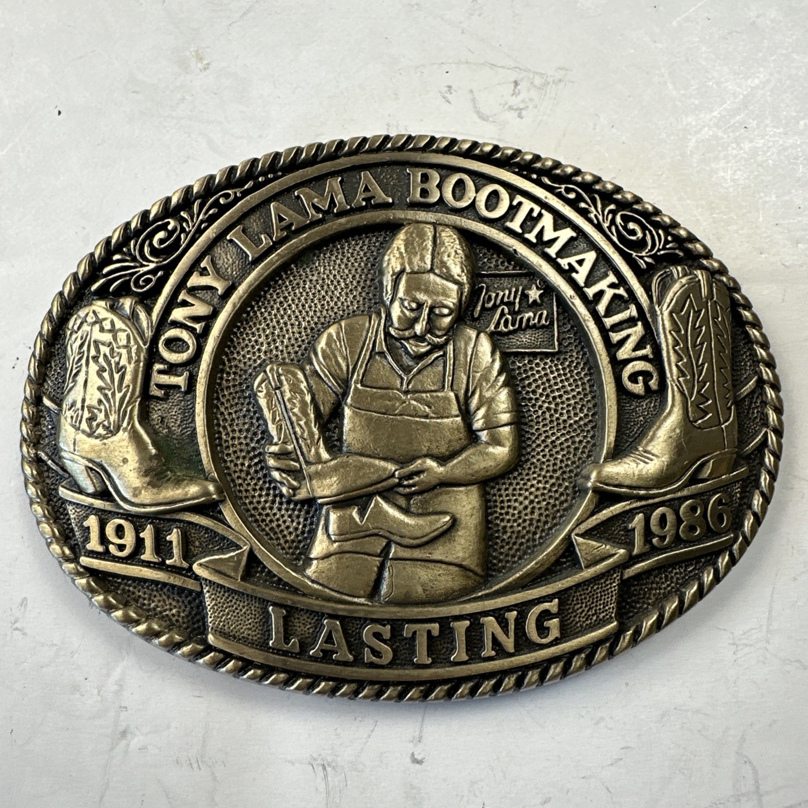 Tony Lama Boot Making 1911 Lasting 1986 Belt Buckle Anniversary Series #65 Brass