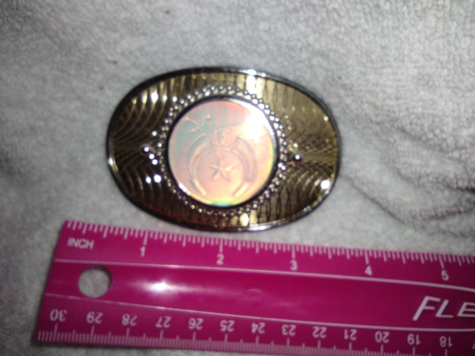 Shiny gold tone belt buckle with Shriners/Mason holographic inset picture