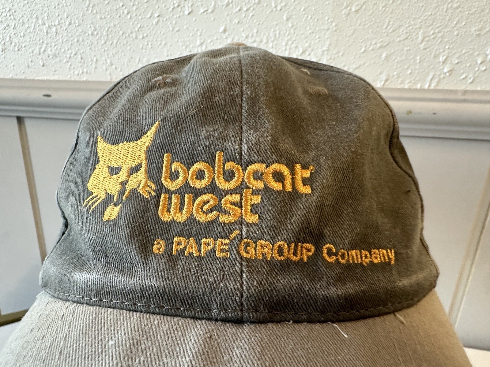Vintage 1990s Coast Point Bobcat West Papé Group Company Gray Strapback Cap