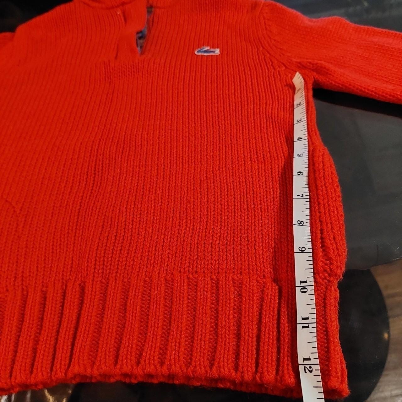 Vintage red Lacoste hooded sweater with plaid detail and pockets.