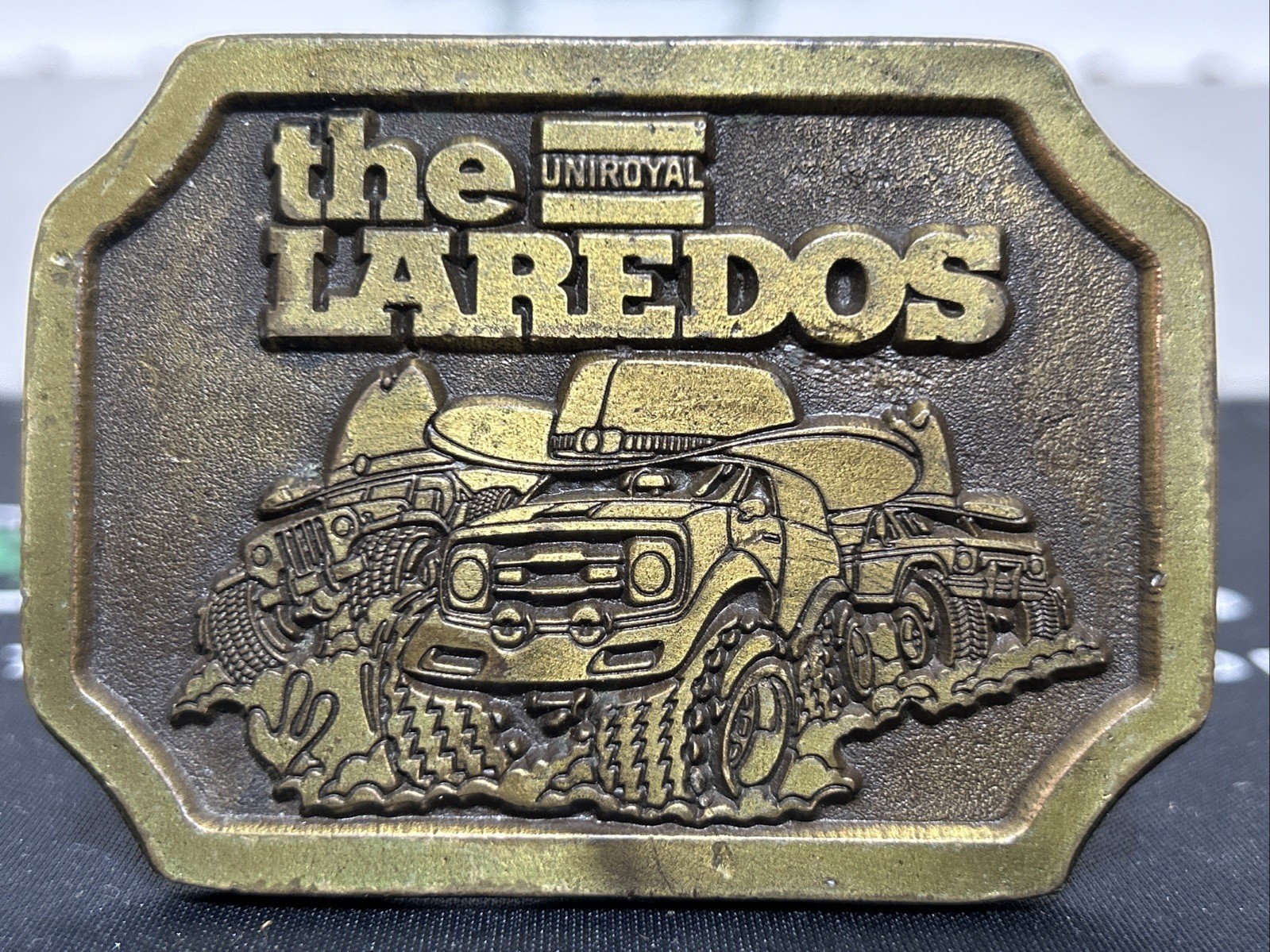 Authentic VINTAGE 1970s **UNIROYAL THE LAREDOS**TIRES ADVERTISEMENT BELT BUCKLE