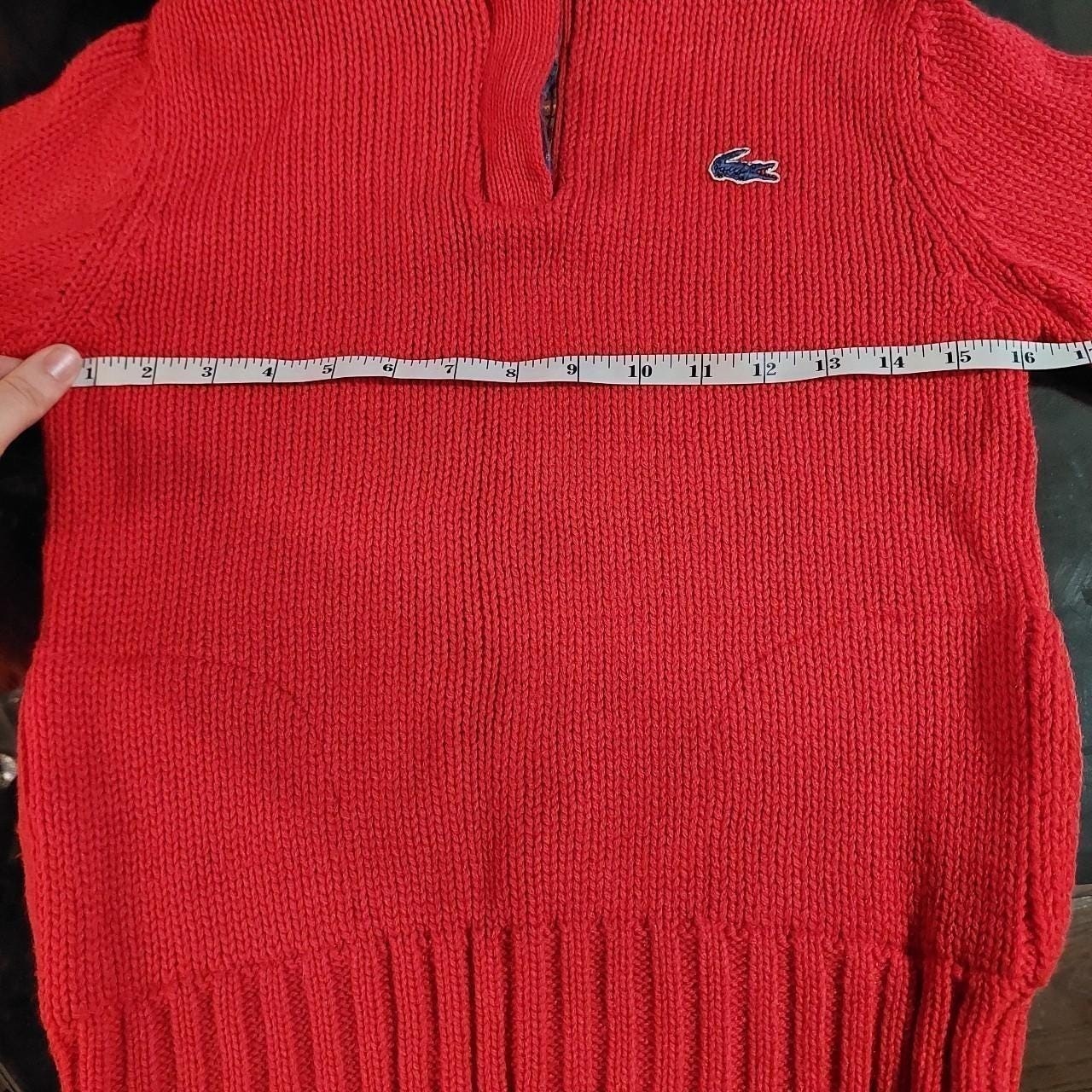 Vintage red Lacoste hooded sweater with plaid detail and pockets.
