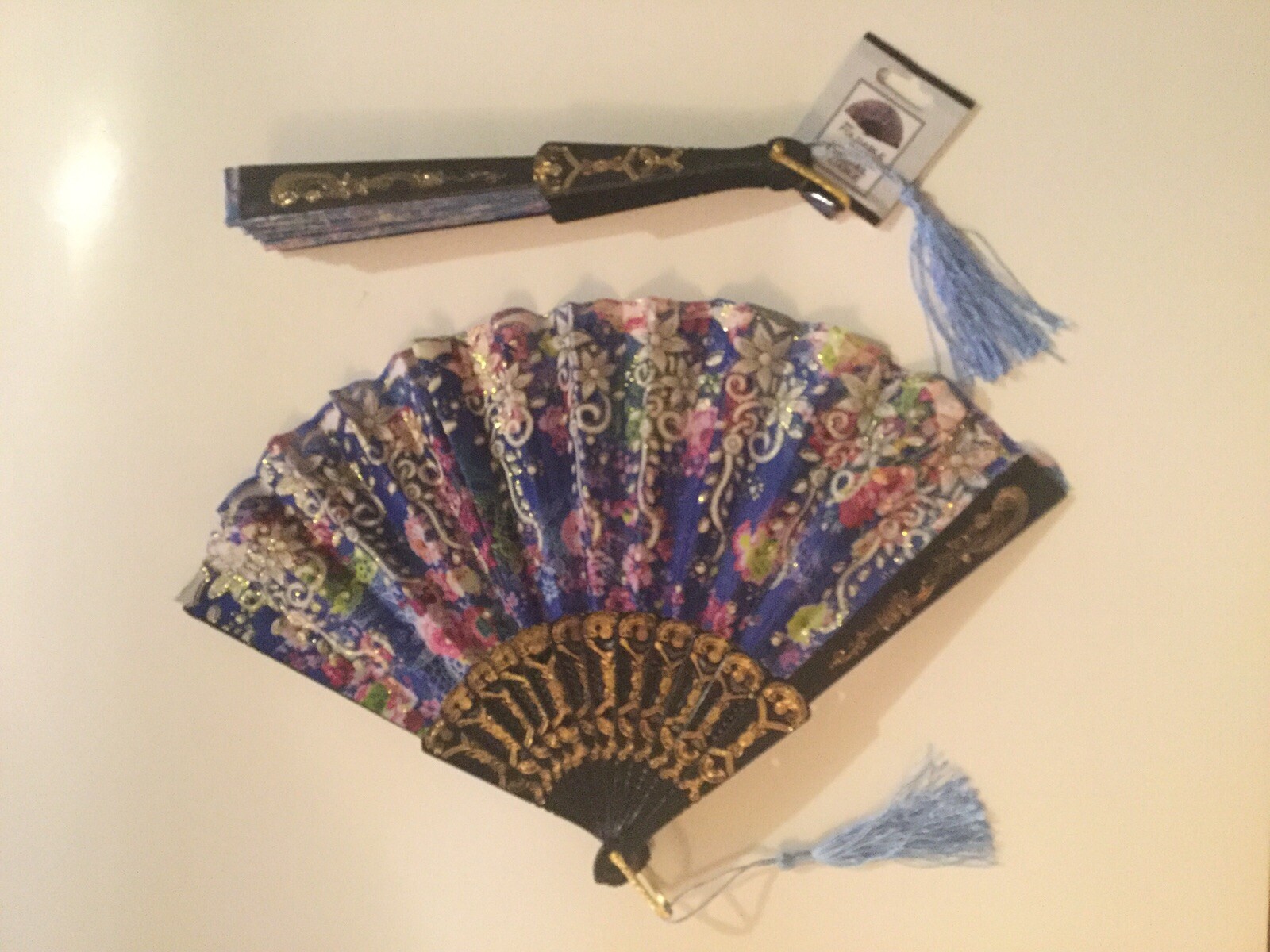 July 4th floral hand fans 2 foldable cloth metallic tassel 9 in plastic