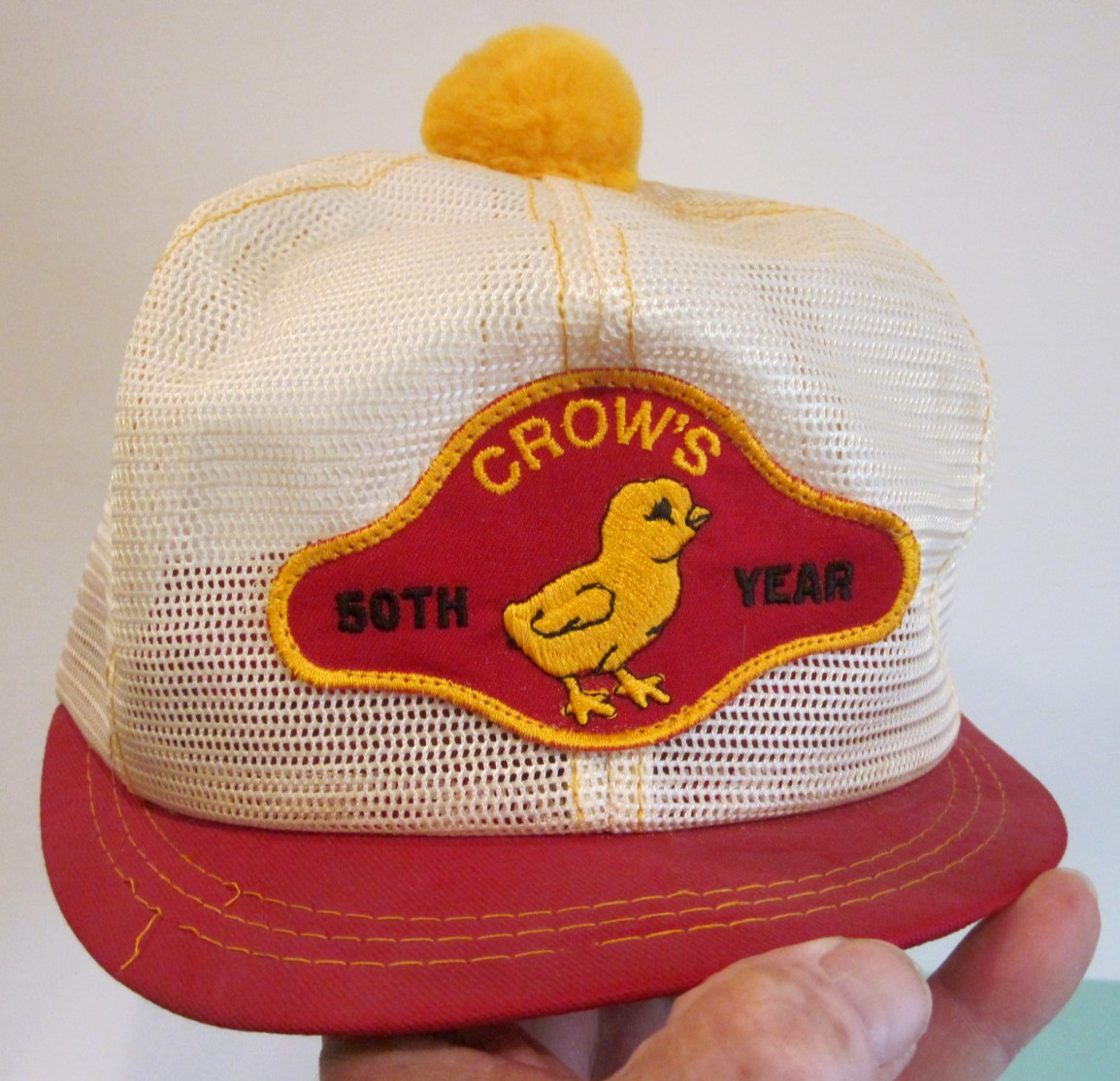 VTG HAT 1980’S FARM AG ALL WHITE MESH SHORT BILL YELLOW POM POM CROW’S HYBRIDS